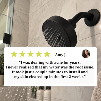 A matte black wall-mounted shower head with water running from it, shown installed on a tiled bathroom wall. A large review card with a star rating and testimonial text is overlaid across the center, along with a small circular profile photo.
